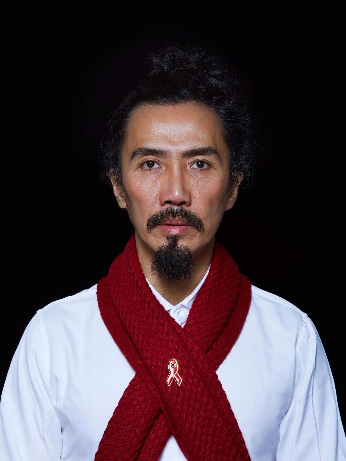 1 Dec 2017 World Aids Day Derong is wearing a red scarf with the red ribbon pinned on it